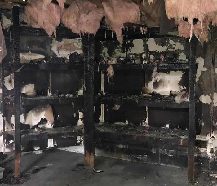 fire damage shelving with debris and insulation